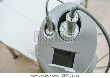 Grey Endospheres Apparatus With Hoses Near Beauty Couch In Clinic
