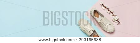Beige Fashionable Women's Espadrilles With Spring Flowering Branch On Color Pastel Blue Pink Backgro