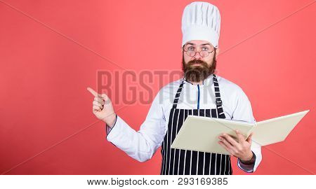 According To Recipe. Man Bearded Chef Cooking Food. Culinary Arts Concept. Amateur Cook Read Book Re