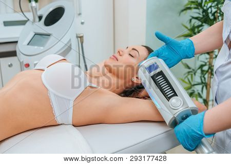 Cropped View Of Cosmetologist Doing Endospheres Therapy For Arm