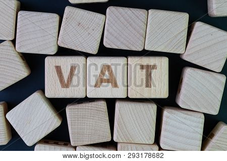 Vat, Value Added Tax Concept By Cube Wooden Block With Alphabet Building The Word Vat At The Center 
