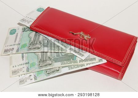Red Wallet With Money Lying On White Background