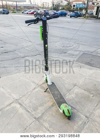 Thessaloniki, Greece - April 04 2019: A Parked Lime Electric Scooter Rental Without Passenger. A Gre