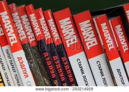 St. Petersburg, Russia - March 31, 2019: Marvel Comic Books Hardback Stacks In Row On Shelf Close Up