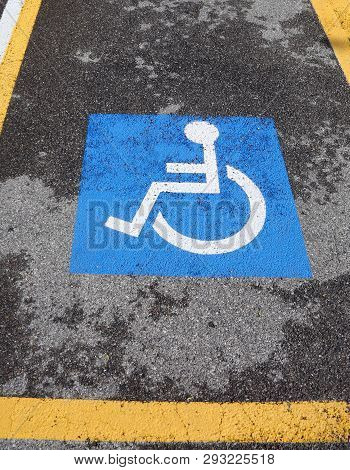 Wheelchair Symbol On A Car Parking For Disabled People