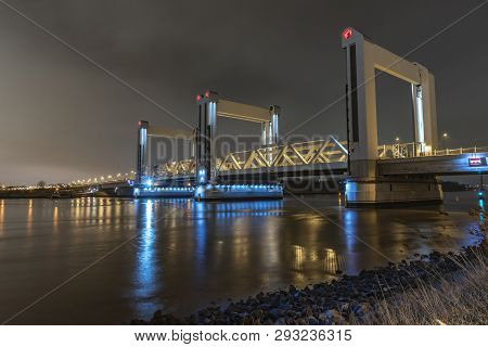 Rotterdam, 21 March 2019 - View Of The Botlek Bridge At The Entrance Of Rotterdam City By Boats Refl