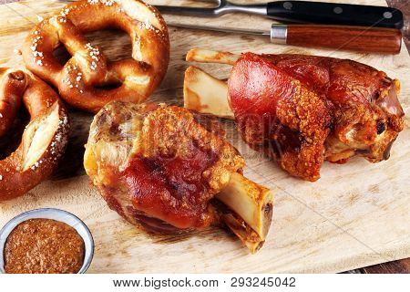 Traditional German Cuisine, Schweinshaxe Roasted Ham Hock And Pretzels