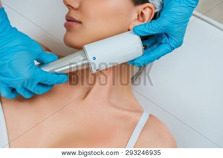 Partial View Of Cosmetologist Doing Endospheres Therapy For Face