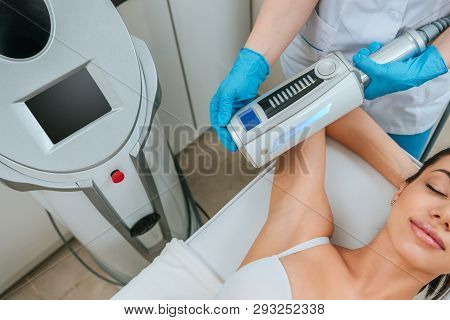 Cropped View Of Cosmetologist Doing Endospheres Therapy For Arm