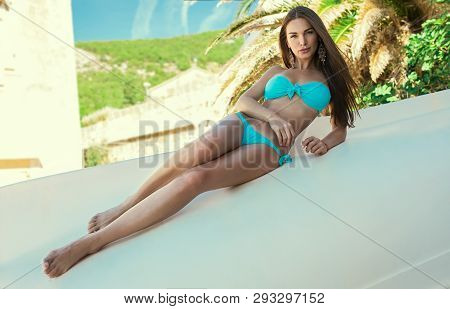 Sexy Brunette Woman With Long Legs Posing