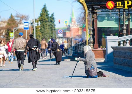 Moscow, Russia - April, 1, 2019: beggars begging near the Cathedral of Christ the Savior in Moscow, Russia