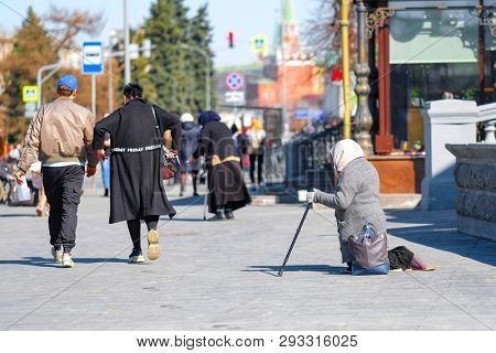 Moscow, Russia - April, 1, 2019: beggars begging near the Cathedral of Christ the Savior in Moscow, Russia