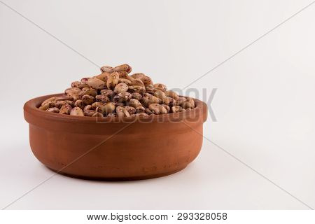 A Plate Of Beans On White Background
