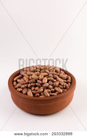 A Plate Of Beans On White Background
