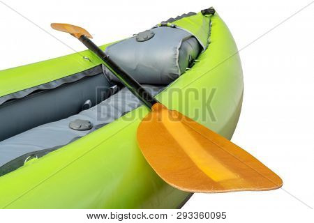 bow of green inflatable whitewater one person kayak with a paddle isolated on white