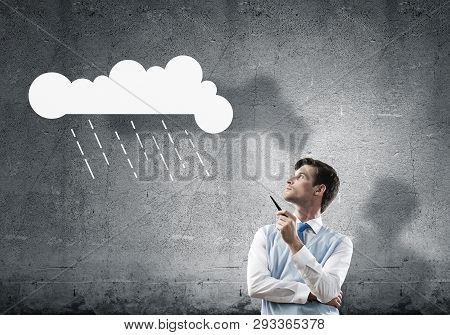 Horizontal Shot Of Confident And Young Businessman In Smart-casual Wear Smoking Pipe While Standing 