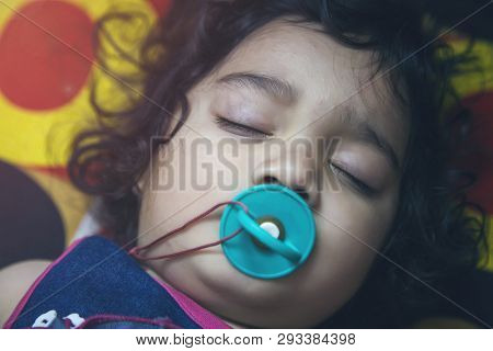 Closeup Of An Indian Toddler Baby Sleeping. Closeup Of An Asian Indian Infant Baby Sleeping