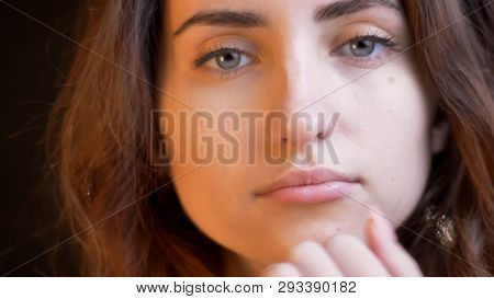 Closeup Shoot Of Young Attractive Caucasian Female Face Being Thoughtful Looking At Camera With Boke