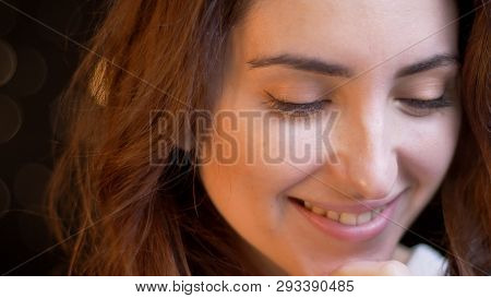 Closeup Shoot Of Young Attractive Caucasian Female Face Smiling And Being Joyful With Background Iso