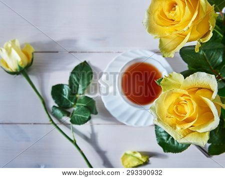 Yellow Roses And A Cup Of Hot Drink Top View
