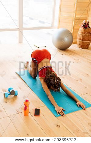 Woman Wearing Sport Shorts And Top Stretching After Tabata