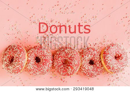 Five Coral Donuts. Donuts With Icing On Pink Background.