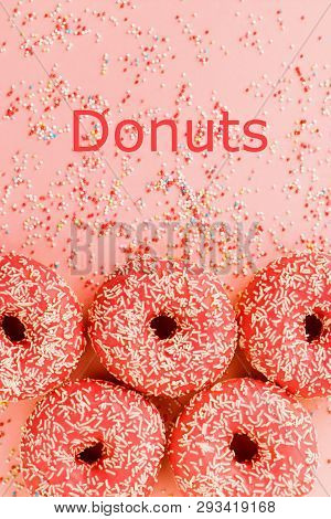 Five Coral Donuts. Donuts With Icing On Pink Background.
