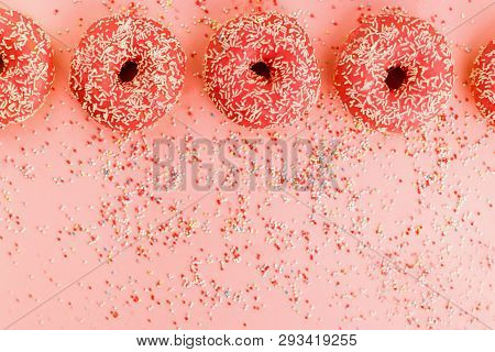 Five Coral Donuts. Donuts With Icing On Pink Background.