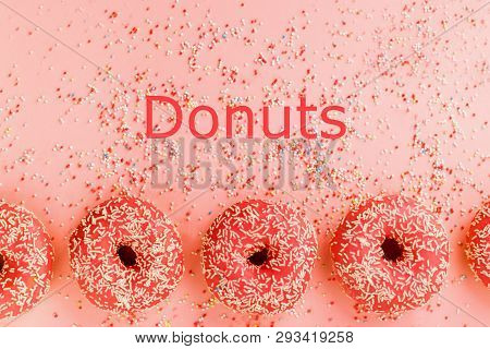 Five Coral Donuts. Donuts With Icing On Pink Background.