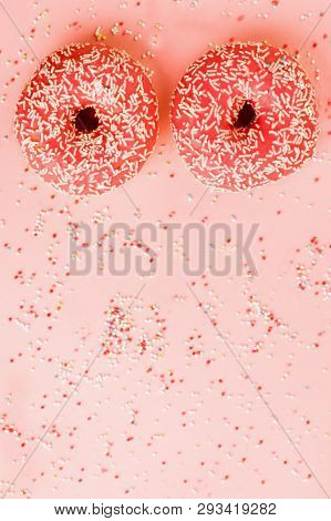 Two Coral Donuts. Donuts With Icing On Pink Background.