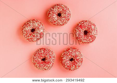Five Coral Donuts. Donuts With Icing On Pink Background.
