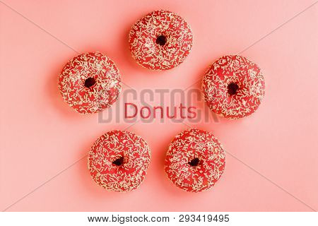 Five Coral Donuts. Donuts With Icing On Pink Background.