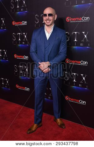 LAS VEGAS - APR 02:  Pitbull aka Armando Christian Perez arrives for the CinemaCon 2019 - STXfilms presentation 