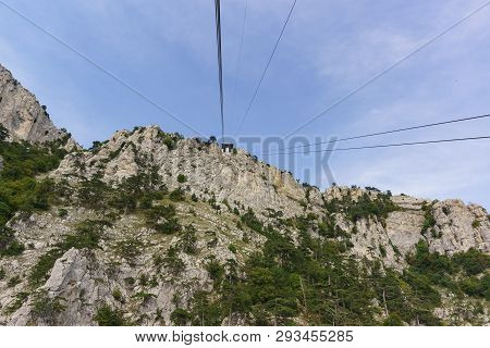 Ropes Tourist Suspension Lift Rise To The Station At The Top Of The High Crimean Mountain Ai-petri. 