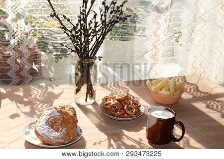 A Mug Of Milk, A Cup Of Corn And Cake On A Sunny Table, A Bouquet Of Spring Flowers For Mood, Diet F