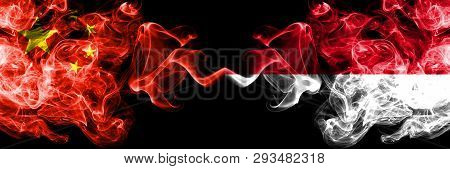 China Vs Monaco, Monacan Smoke Flags Placed Side By Side. Thick Colored Silky Smoke Flags Of Chinese