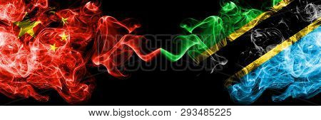 China Vs Tanzania, Tanzanian Smoke Flags Placed Side By Side. Thick Colored Silky Smoke Flags Of Chi