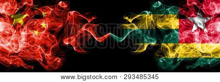 China Vs Togo, Togolese Smoke Flags Placed Side By Side. Thick Colored Silky Smoke Flags Of Chinese 