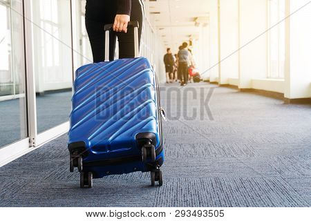 Traveler Women And Luggage At Airport Terminal Travel Concept