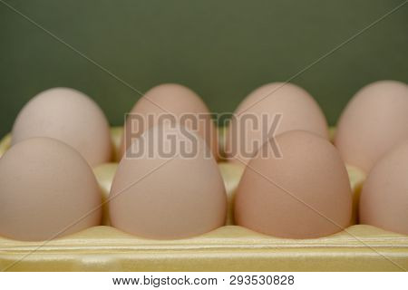 Chicken Eggs Lie In A Yellow Plastic Tray.