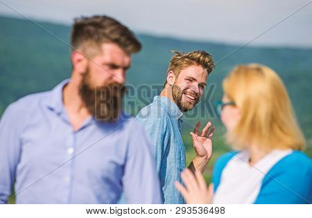 Jealous Concept. Man With Beard Jealous Aggressive Because Girlfriend Interested In Handsome Passerb
