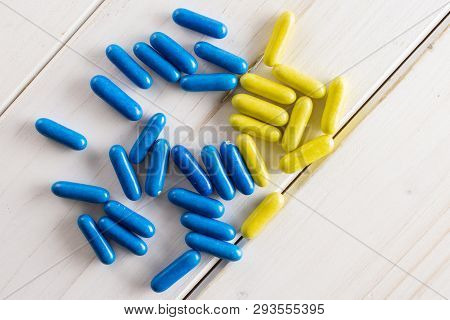 Lot Of Whole Blue And Yellow Sweet Licorice Comfit Flatlay On White Wood