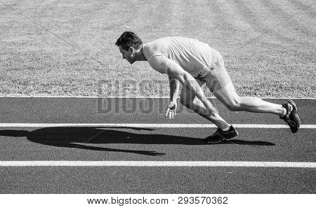 Runner Captured In Motion Just After Start Of Race. Runner Sprint Race At Stadium. How To Start Runn