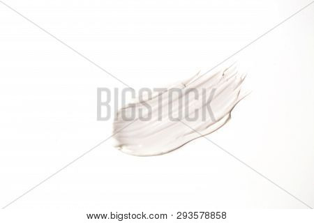 Sample Of White Cosmetic Product Isolated On White Background. Smear Of Moisturizing Face Cream, Bod