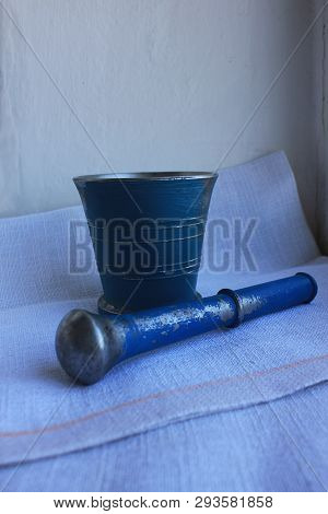 Ancient Metal Mortar With Pestle On Linen Background