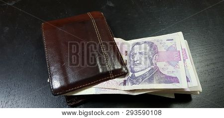 Brown Leather Wallet Full With Czech Republic Coruna Banknotes Lay On Black Table