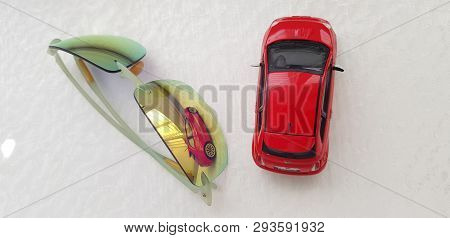 Rishon Lezion, Israel - March 8 2019: Small Red Fiat 500 Toy Reflected In Green Sunglasses Isolated 
