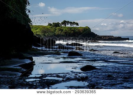 Volcanic Coast With Rocks And Black Sand On Bali, Indonesia
