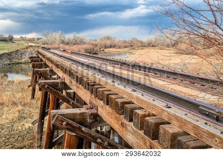 railroad timber trestle destroyed by river flooding - St Vrain Creek near Platteville, Colorado