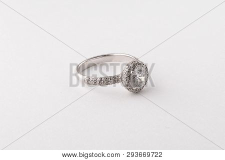 Womens Silver Diamond Ring In The Shape Of A Circle With A Fringe Isolated On A White Background.